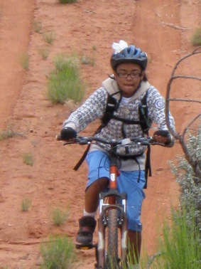 A rider in the Tour de Rez on a bike purchased by Eve’s Fund.