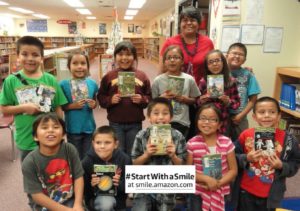 Smiling Navajo second graders who are learning to read donated Magic Tree House books.