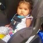 Navajo baby in car seat