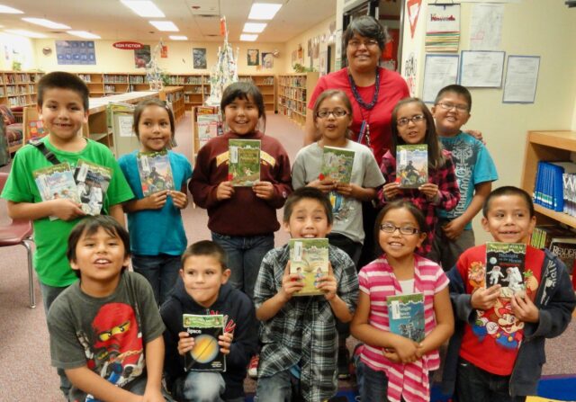 Navajo Kids reading Magic Tree House books