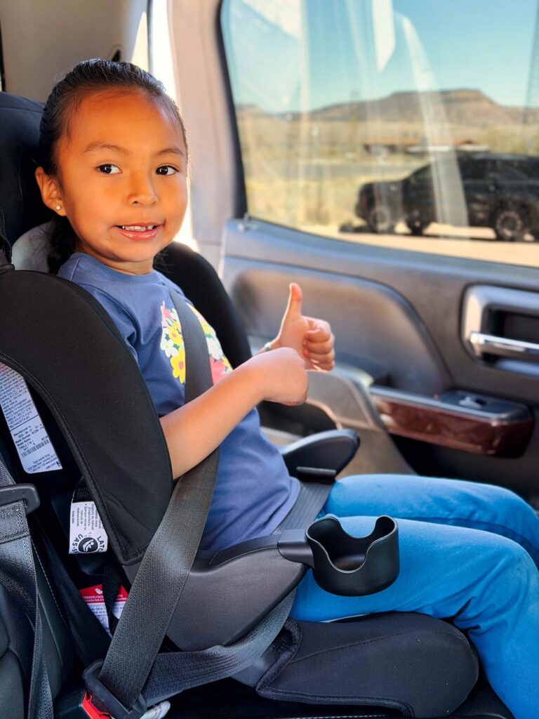 Child buckled up in Booster seat