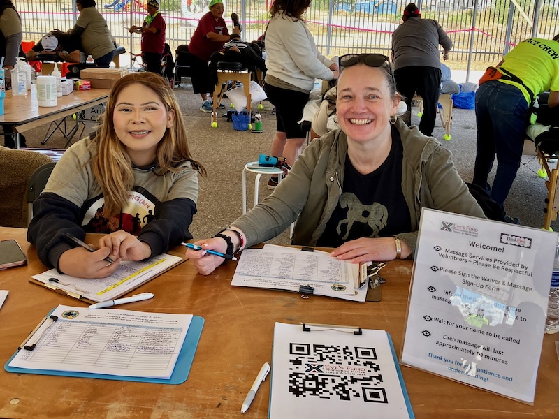 Eve's Fund volunteers welcome marathon finishers at the 2026 Shiprock Marathon